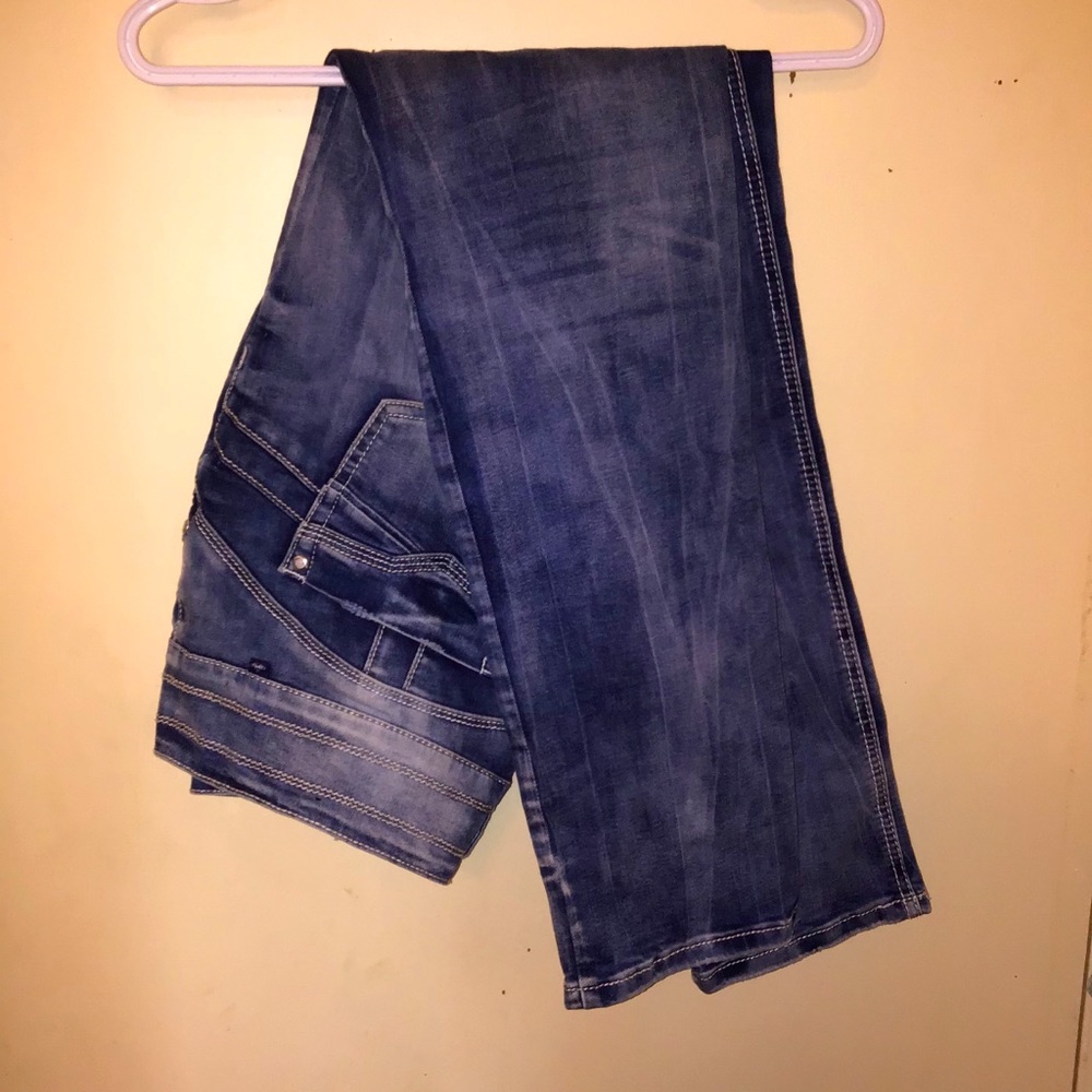 3 buttoned blue jeans